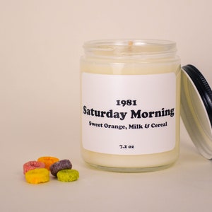 Large container candle in clear glass jar with metal lid, shown with Froot Loops cereal.