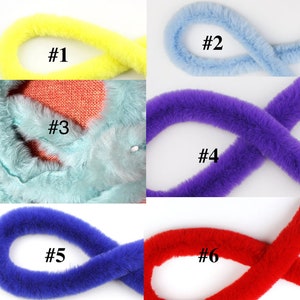 May include: Six different colors of faux fur trim, each in a loop. The colors are yellow, light blue, light blue, purple, blue, and red. The trim is labeled with numbers 1 through 6.
