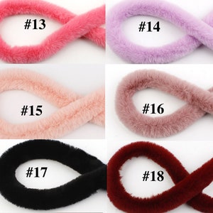 May include: Five different colors of faux fur trim, each shown in a loop. The colors are pink, purple, light pink, rose, black, and burgundy. The trim is labeled with numbers 13 through 18.