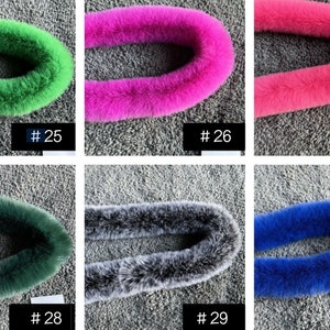 May include: Six different colours of faux fur trim, each in a loop shape. The colours are green, pink, hot pink, dark green, grey, and blue. The trim is labelled with numbers 25 through 30.