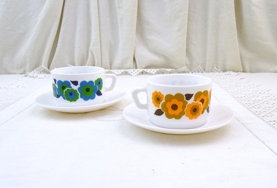 2 Vintage French Mid Century White Milk Glass Coffee Cup and Saucer by Arcopal with Stylized Flower Pattern Orange and Blue Green, 1970s Mug