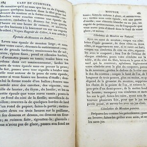 May include: A page from a vintage cookbook with a recipe for preparing a shoulder of mutton. The recipe includes instructions for seasoning, braising, and serving the meat. The text is in French.