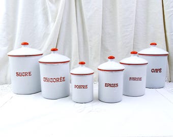May include: Set of six white enamel canisters with red lids and red lettering. The canisters are labeled "Sucre", "Chicoree", "Poivre", "Epices", "Farine", and "Cafe".