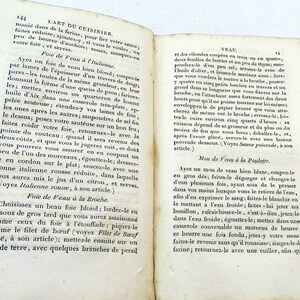 May include: A page from a vintage French cookbook, "L'Art du Cuisinier", with instructions on how to prepare veal dishes. The text describes different methods for cooking veal, including roasting, braising, and sauteing.