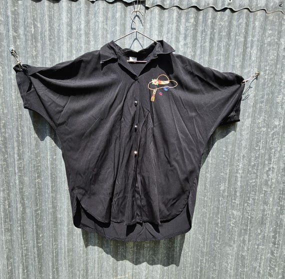 Vintage French 1980s Lady M Black Batwing Short Sleeved Blouse with Embroidered Design of Woman in a Large Brimmed Hat, 80s Chic Fashion