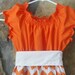 Reviewed by Anonymous reviewed Ladies Orange and White Chevron Peasant Dress for Fall, Gameday, or Thanksgiving
