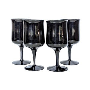 May include: Set of four black wine glasses with a dark, almost opaque, finish. The glasses have a classic, elegant shape with a wide bowl and a long stem.