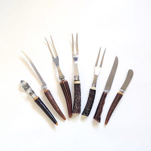 May include: A handmade wooden sign with the text "Welcome" in a playful font. The sign features a distressed white background and a dark brown frame, perfect for a front door or entryway. The sign measures approximately 12 inches wide and 6 inches tall.