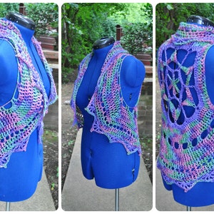 May include: A crocheted vest with a colorful, multi-colored design. The vest has a unique open back design and a scalloped hem.