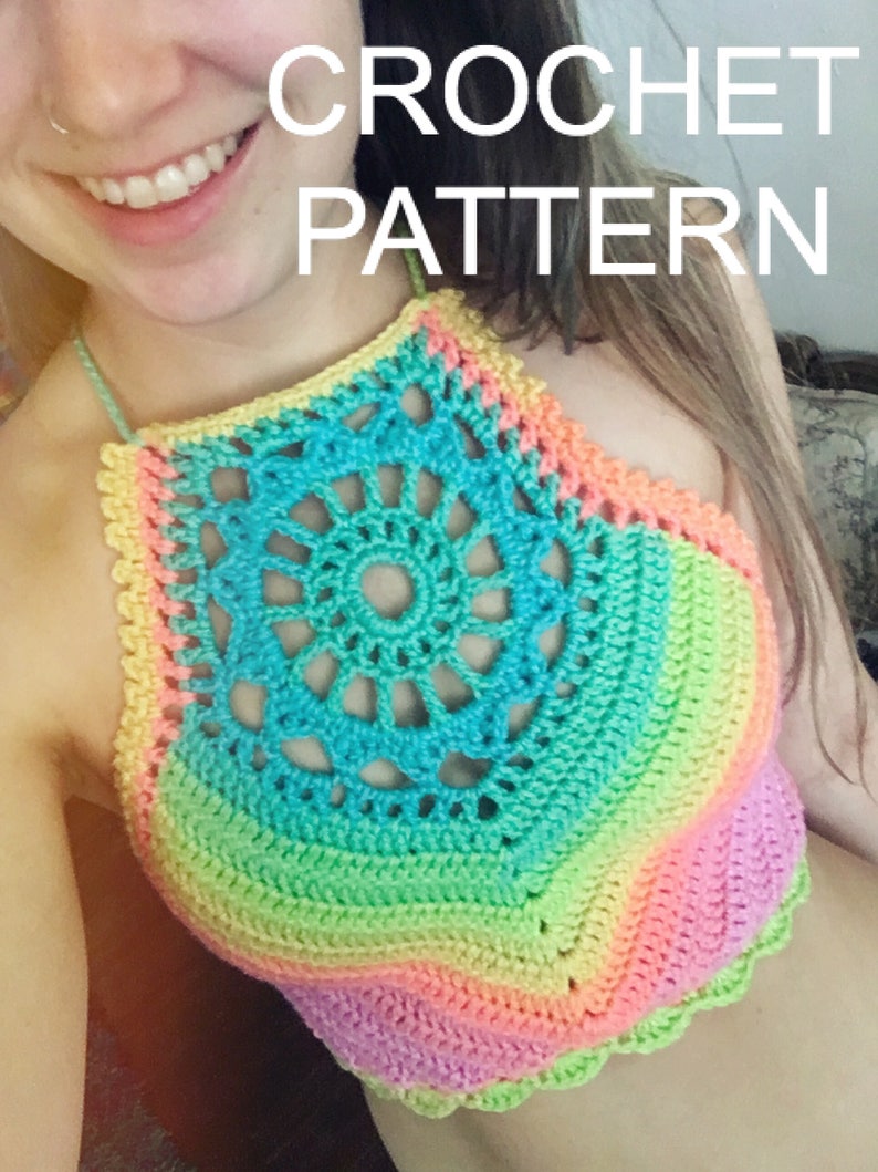 May include: A rainbow crochet halter top with a crocheted flower design in the center. The top is made with a variety of colors, including pink, orange, yellow, green, blue, and purple.