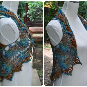 May include: A crocheted vest with a brown, blue, and green color pattern. The vest has a V-neck and a scalloped hem.
