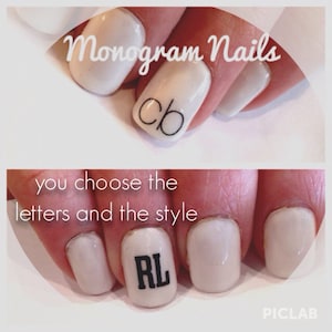 May include: Close-up of two fingernails with white polish and black lettering. The first nail has the letters "cb" and the second nail has the letters "RL". The text "Monogram Nails" is at the top of the image. The text "you choose the letters and the style" is below the nails.