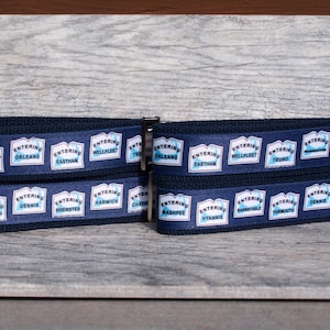 May include: Two blue and white striped keychains with silver key rings. The keychains feature the text "Entering" and the names of various towns on Cape Cod, Massachusetts.