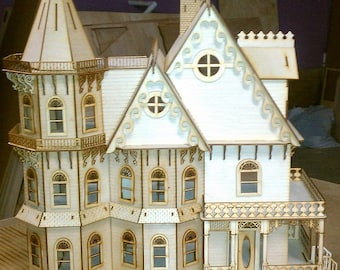 May include: A white wooden dollhouse with a tower, a porch, and many windows. The dollhouse is made of laser-cut wood and has a detailed design.