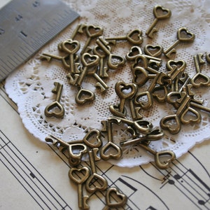 20 Antique Bronze Tiny Open Heart Keys