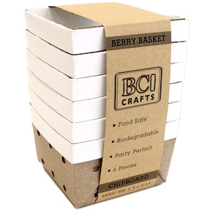 May include: A stack of six white chipboard berry baskets with a brown paper label that reads "BERRY BASKET", "BCI CRAFTS", "Food Safe", "Biodegradable", "Party Perfect", "6 Pieces", "CHIPBOARD", and "BASKET SIZE: 4" x 4" x 2.5"