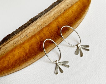 Modern silver oval earrings with petals, minimalist abstract floral earrings