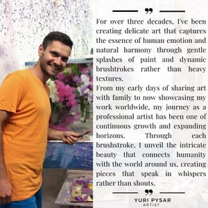 May include: A man in an orange t-shirt and blue jeans smiles while holding a paintbrush in front of a painting. The painting features a floral arrangement with pink and white flowers. Text on the right side reads "YURI PYSAR ARTIST".