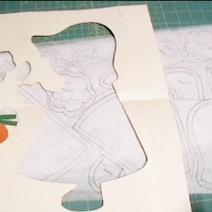 Mailed Sunbonnet Sue with Flower -9 interfacing patterns, instruction sheet, 18 leaves, 18 stems, 9 flower centers, and the "Guide"