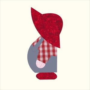 May include: A whimsical gnome figure with a red hat and a red and white checkered shirt. The gnome's body is gray, and the hat and base are a textured red. The design is set against a cream-colored background.
