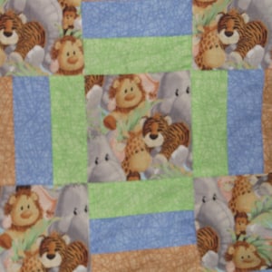 Animal Themed Quilt for Toddlers and Children with Soft Blue and White Zebra Print for Backing. FREE SHIPPING