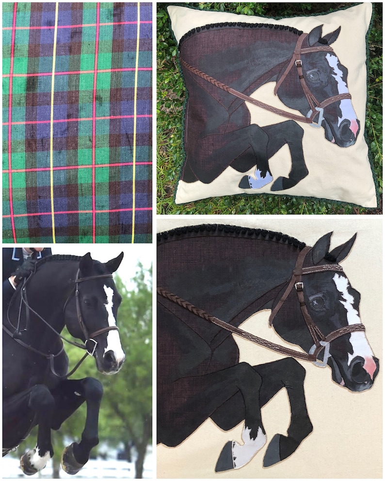 May include: A black and white horse jumping over a fence. The horse is wearing a brown bridle and a braided leather rein. The horse is depicted in a realistic style on a cream-coloured pillow with a green border.