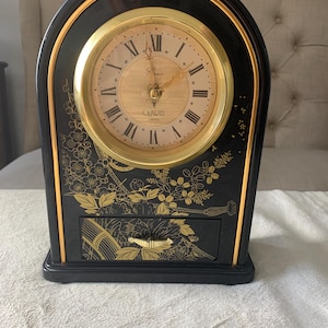 May include: A set of three ceramic mugs with a speckled, matte finish. The mugs are in shades of cream, light gray, and dark gray. Each mug has a simple, minimalist design, perfect for coffee or tea.