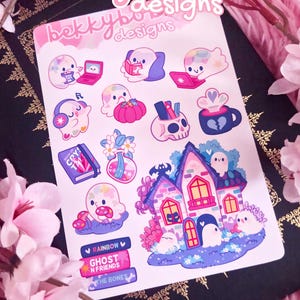 May include: A sheet of stickers featuring cute ghost characters with laptops, books, and other items. The stickers include a haunted house, a skull with pencils, and text that reads "Rainbow", "Ghost N Friends", and "The Bones". The brand name "bekkybubble designs" is at the top.