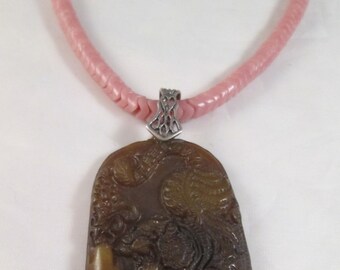 Carved jade tiger pendant, sterling bail, vintage African glass snake beads, sterling hand connectors, silk cord ties give adjustable length