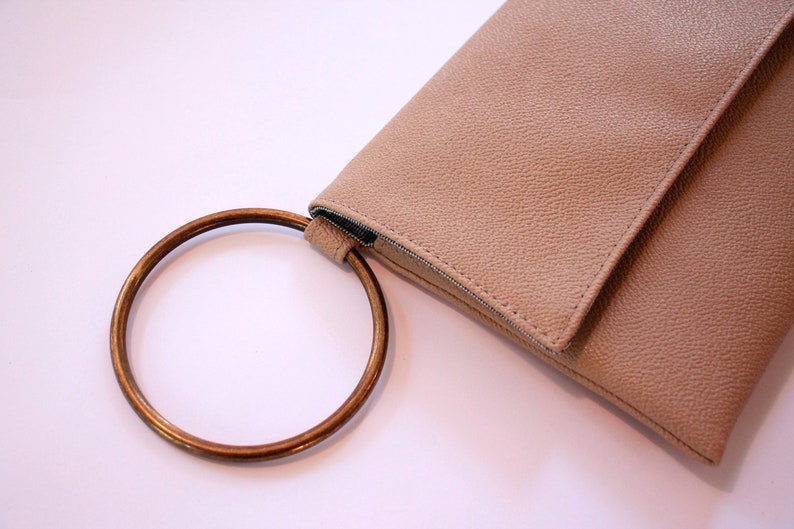 small beige clutch bag