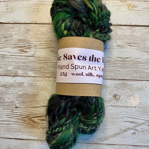 Mini-skein of dark green textured hand-spun art yarn