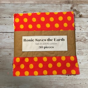 May include: A pack of 30 reusable food wraps with a red and yellow polka dot pattern. The pack is labelled "Rosie Saves the Earth" and "5x5 in 100% cotton".
