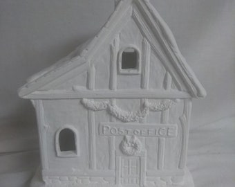 May include: White ceramic post office building with a snow-covered roof, a chimney, and a sign that reads "POST OFFICE".