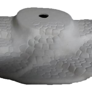 May include: White ceramic base with a textured surface resembling cobblestones. The base has a circular opening in the center.