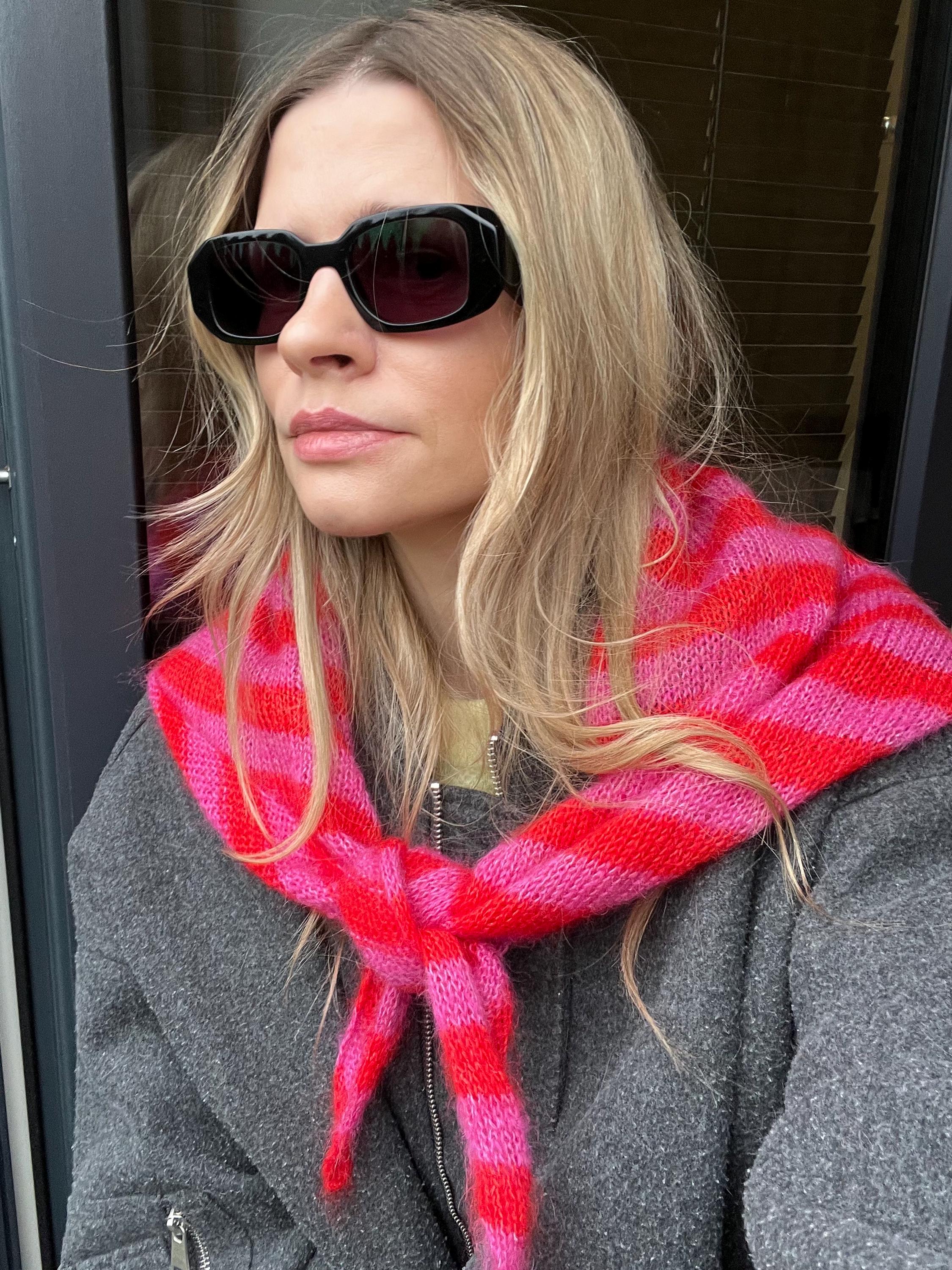 Model wearing a striped mohair scarf by Egretta Garzetta