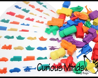 May include: A set of colorful plastic toy vehicles and boats, including cars, trucks, trains, helicopters, and ships. The toys are arranged on a white background with matching images printed on cards.