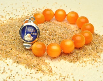 Tangerine Bracelet Features 1939 New York World's Fair Clasp