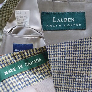 May include: A blazer featuring a blue and tan houndstooth pattern with a beige lining. The interior includes a green Lauren Ralph Lauren label, a Lord & Taylor tag, a white garment information tag, and a green label stating Made in Canada.