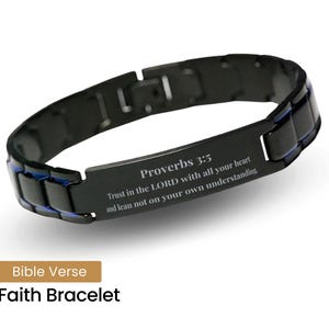 May include: Black stainless steel bracelet with a blue accent and an engraved inscription: "Proverbs 3:5 Trust in the LORD with all your heart and lean not on your own understanding."  Bible Verse Faith Bracelet.