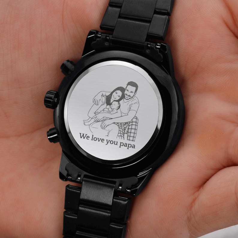 Custom photo laser engraved wooden wristwatch with a personalized family picture on the back dial, luxury leather strap close-up shot.