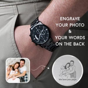 Custom photo laser engraved wooden wristwatch with a personalized family picture on the back dial, luxury leather strap close-up shot.