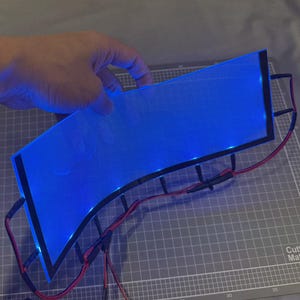 May include: A white ceramic mug with a black handle and the text "But First, Coffee" in a handwritten style. The mug is on a white surface. The mug is approximately 4 inches tall.