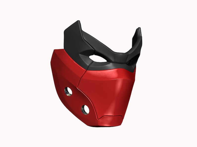 Peut inclure: Un masque en plastique rouge et noir avec un design g&eacute;om&eacute;trique. Le masque a deux petits trous sur le c&ocirc;t&eacute; et une ouverture plus grande pour les yeux.