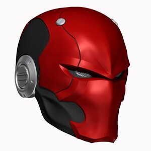 May include: A red and black helmet with a futuristic design. The helmet has a visor and a black and gray pattern on the side.