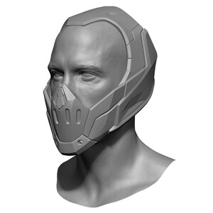 Puede incluir: Un modelo 3D de un casco futurista con una m&aacute;scara facial. El casco es gris y tiene un dise&ntilde;o elegante y angular. La m&aacute;scara facial tiene un dise&ntilde;o de rejilla y cubre la nariz y la boca.