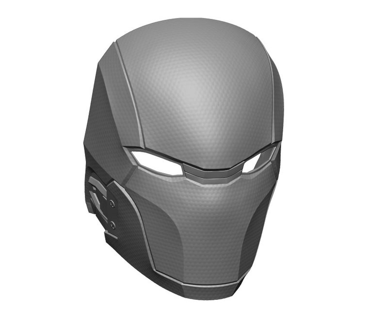May include: A gray 3D printed helmet with a textured surface and a visor. The helmet has a futuristic design with sharp angles and a sleek profile.