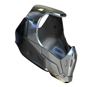 Puede incluir: Un casco futurista plateado y negro con una visera y una nariz puntiaguda. El casco tiene un dise&ntilde;o geom&eacute;trico y parece estar hecho de metal.
