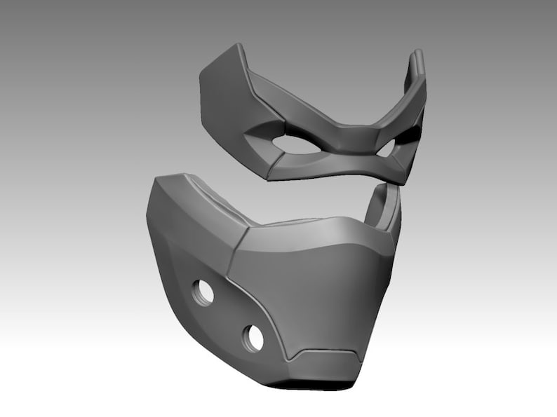Peut inclure: Un masque gris imprim&eacute; en 3D avec un design g&eacute;om&eacute;trique. Le masque est en deux parties, la partie sup&eacute;rieure couvrant les yeux et la partie inf&eacute;rieure couvrant le nez et la bouche.