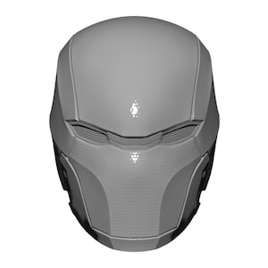 May include: A gray, futuristic helmet with a textured surface and a visor.
