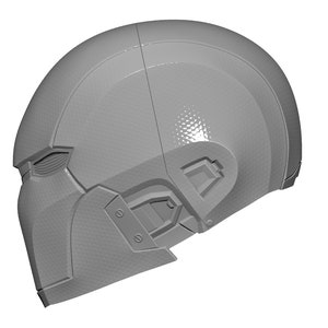 May include: A gray, futuristic helmet with a textured surface and a visor. The helmet has a design that resembles a face mask.